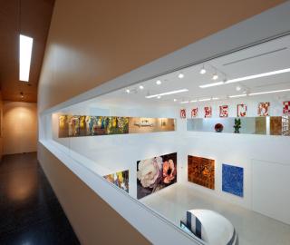 view from first floor dining room across white cube space